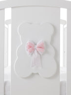 Kiki babybed, detail van het beerpaneel, vierde uitvoering